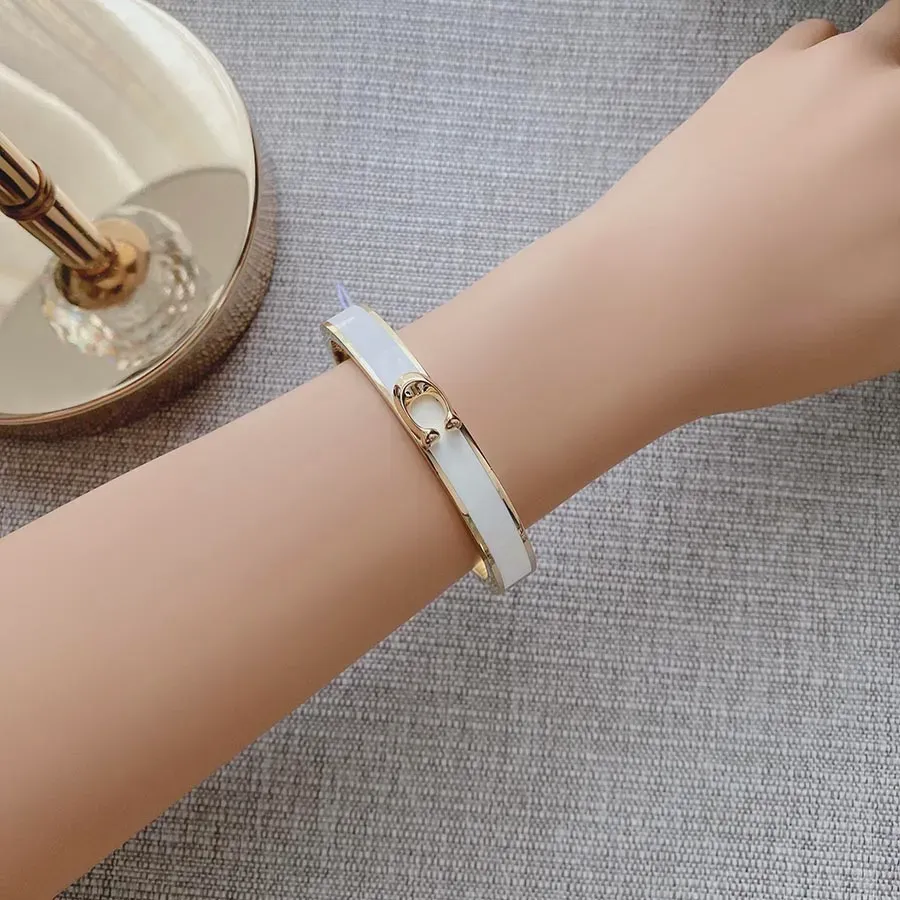 Lắc tay Coach Signature Push Hinged Bangle